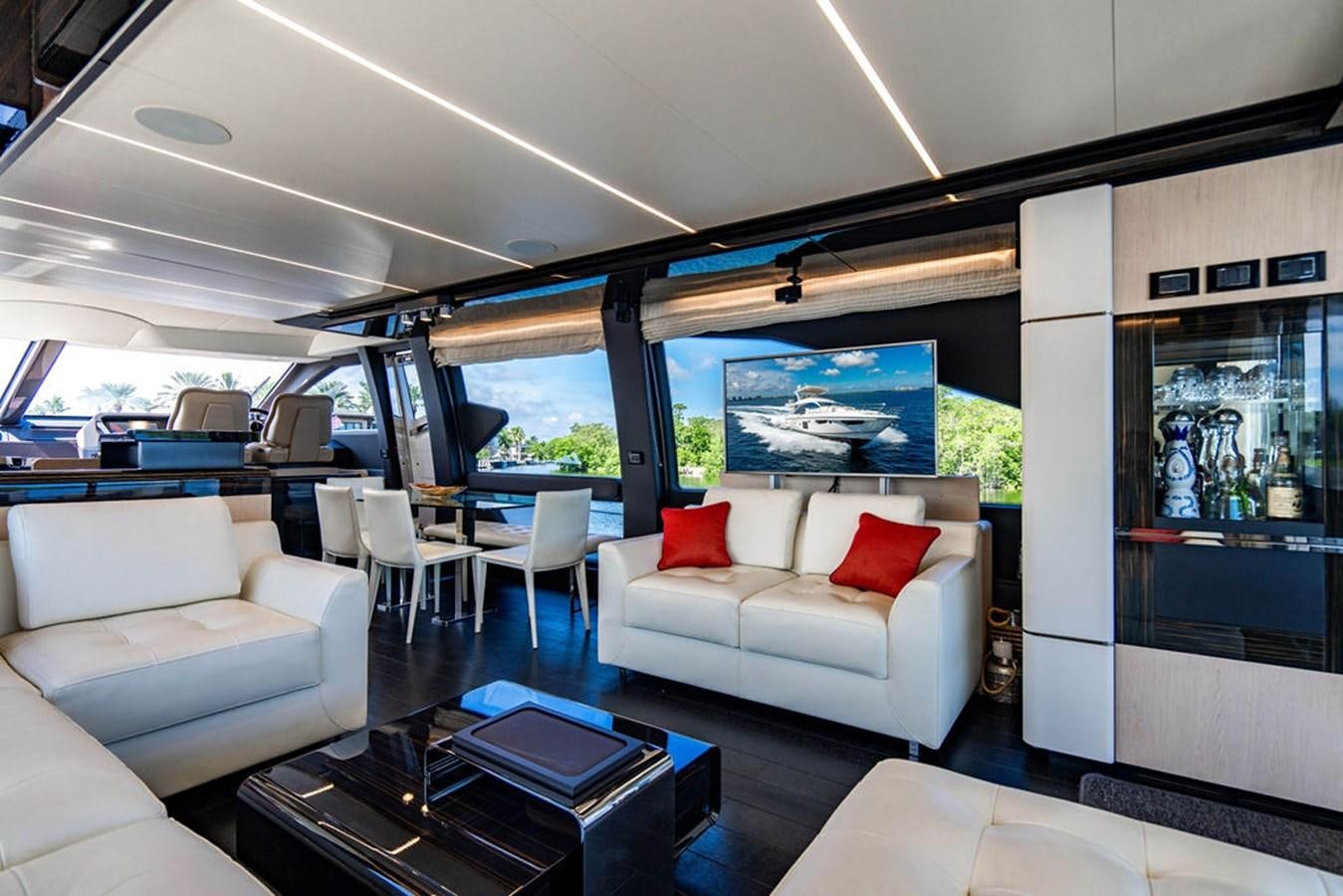 a living room with a couch and a table aboard THE PERFECT MERITAGE Yacht for Sale