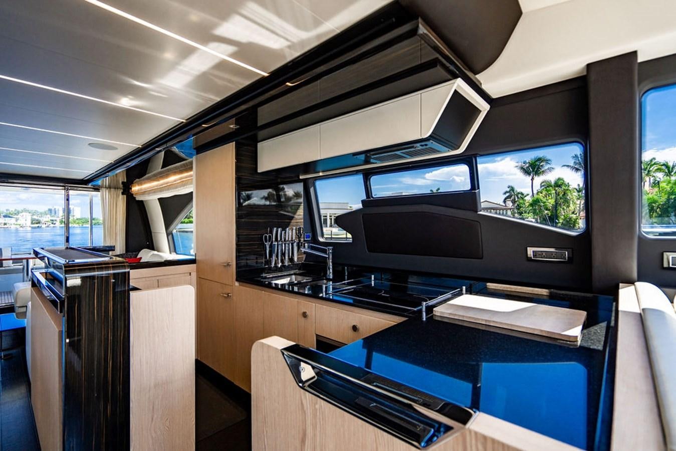 a kitchen with a large window aboard THE PERFECT MERITAGE Yacht for Sale