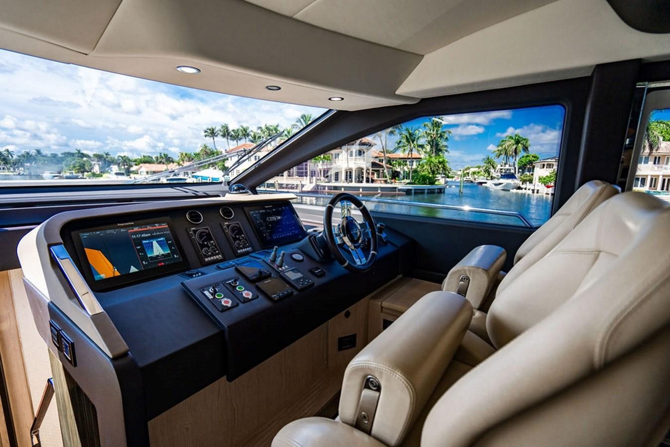 a car with a view of the water and the land below aboard THE PERFECT MERITAGE Yacht for Sale