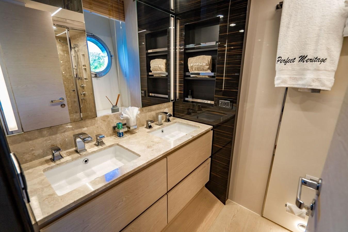 a bathroom with a sink and a mirror aboard THE PERFECT MERITAGE Yacht for Sale