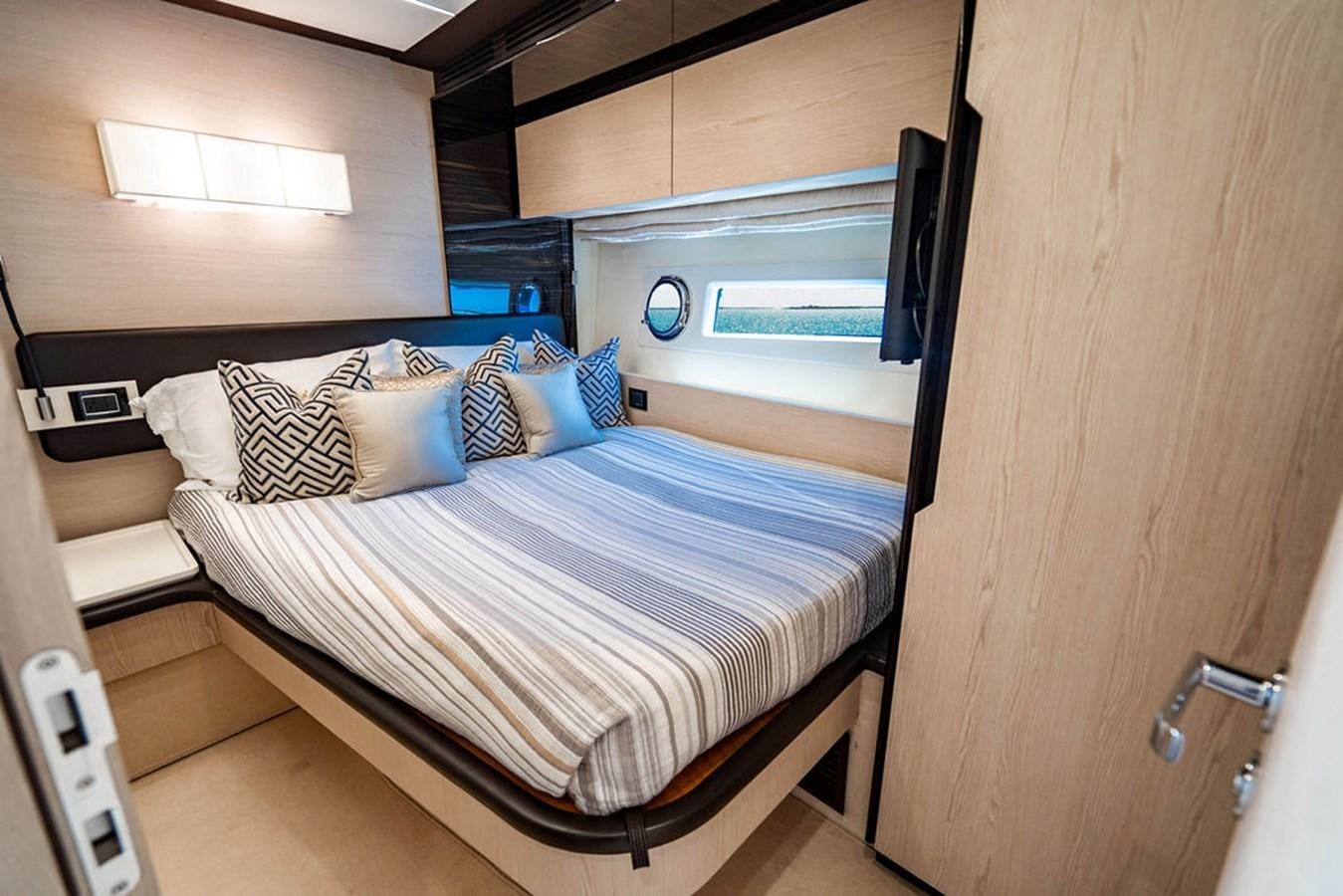 a bed in a room aboard THE PERFECT MERITAGE Yacht for Sale