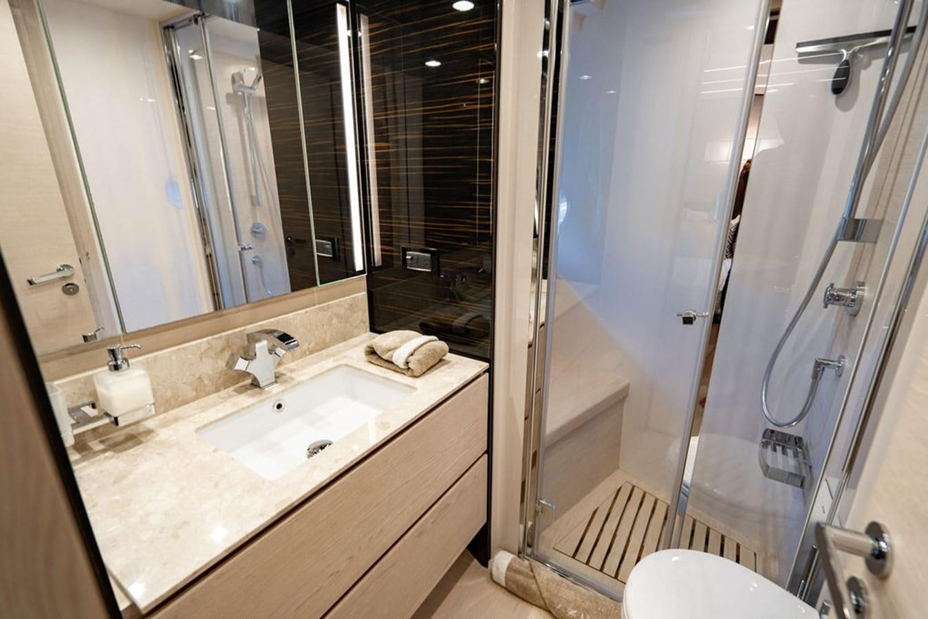 a bathroom with a large mirror aboard THE PERFECT MERITAGE Yacht for Sale