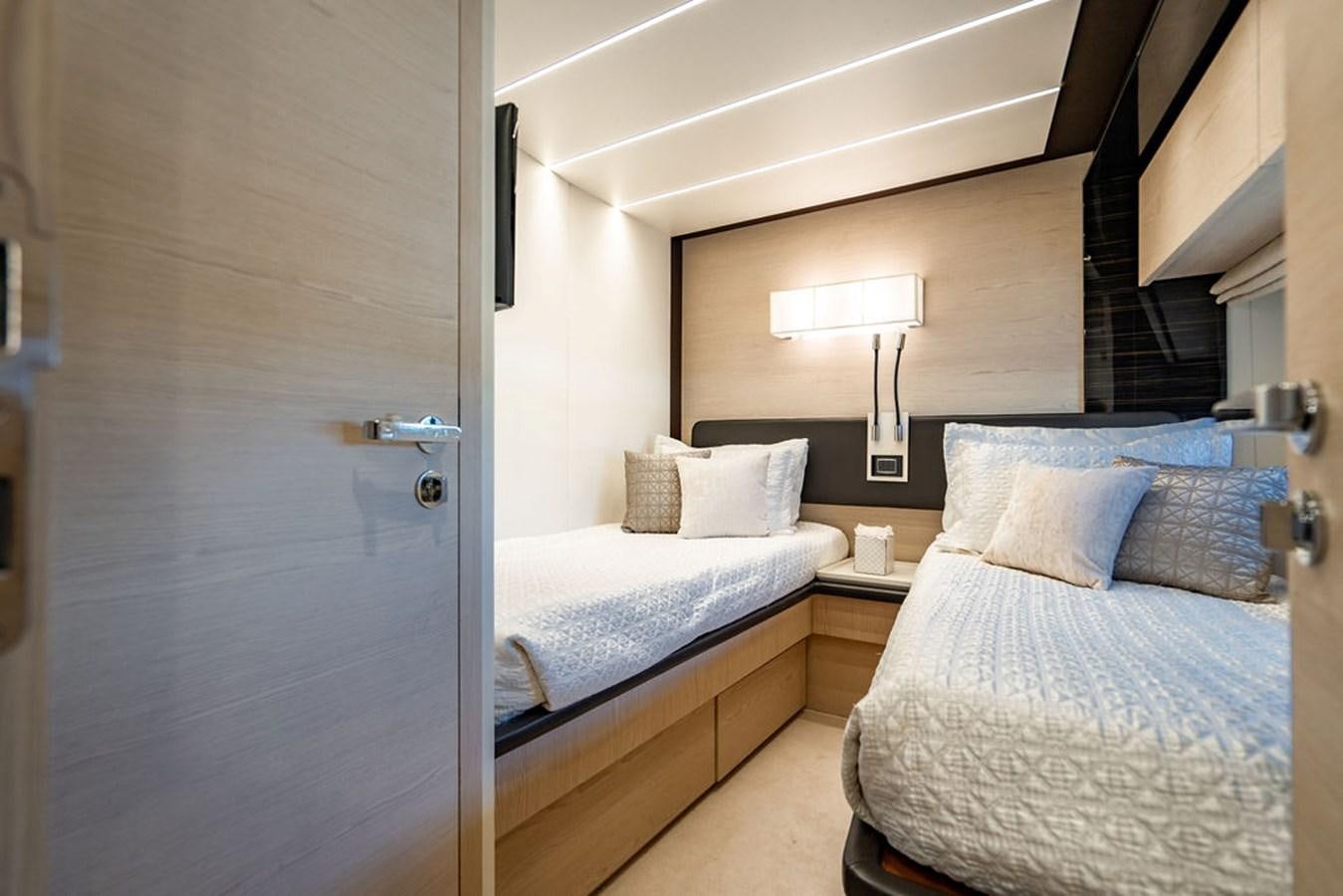 a room with two beds aboard THE PERFECT MERITAGE Yacht for Sale