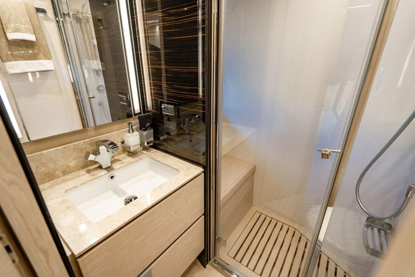 a bathroom with a sink and a mirror aboard THE PERFECT MERITAGE Yacht for Sale