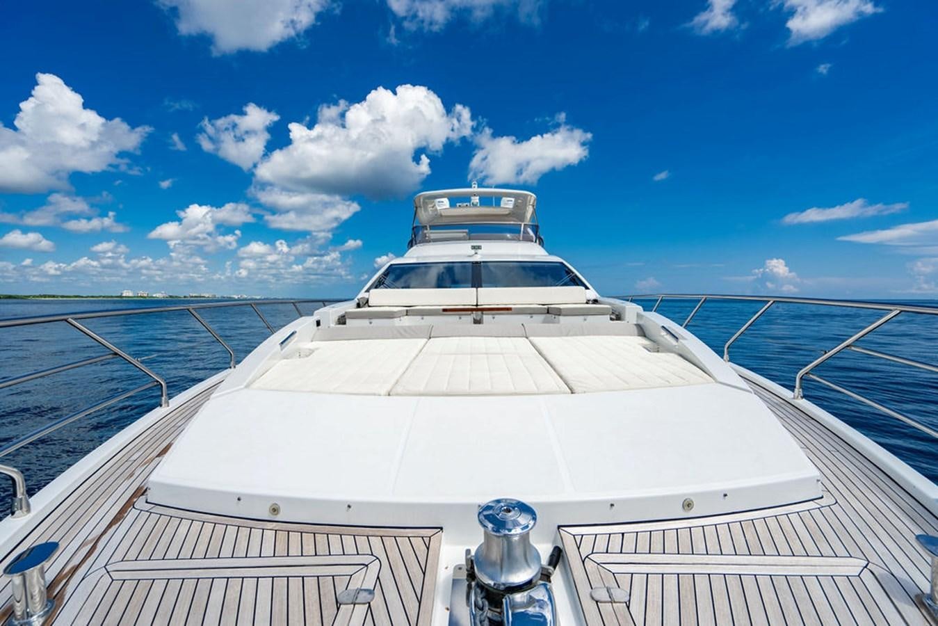 a white yacht on a deck aboard THE PERFECT MERITAGE Yacht for Sale