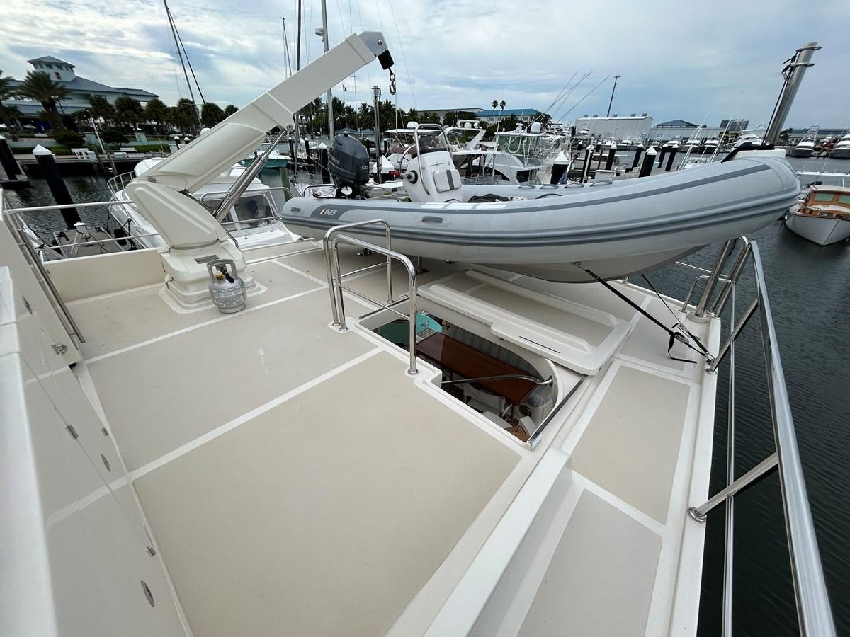 a white boat with a black object on it aboard NOVIA II Yacht for Sale