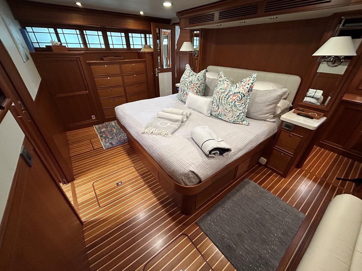 a bed in a room aboard NOVIA II Yacht for Sale