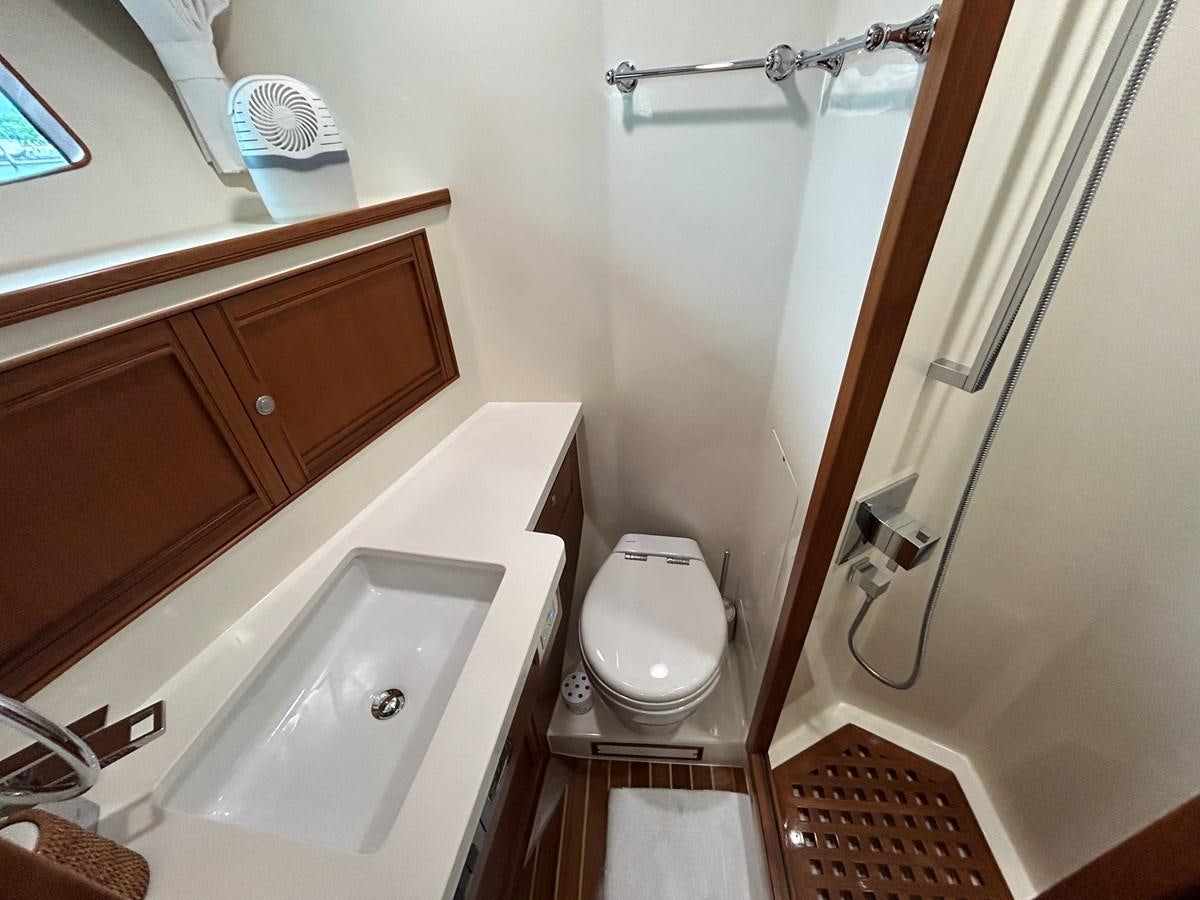 a bathroom with a sink and a toilet aboard NOVIA II Yacht for Sale
