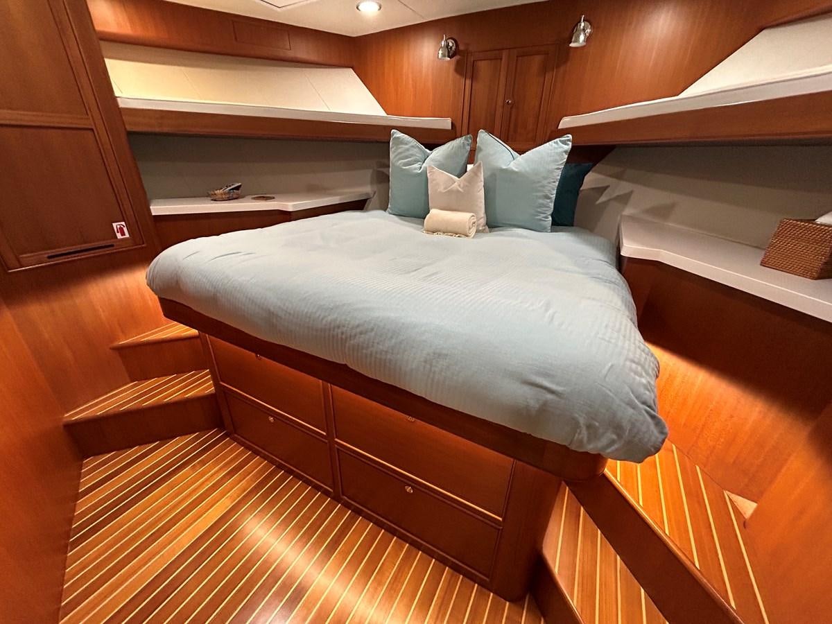 a bed in a room aboard NOVIA II Yacht for Sale