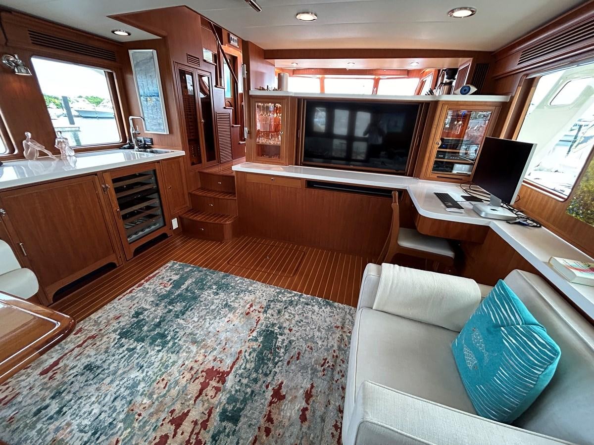 a living room with a couch and a television aboard NOVIA II Yacht for Sale