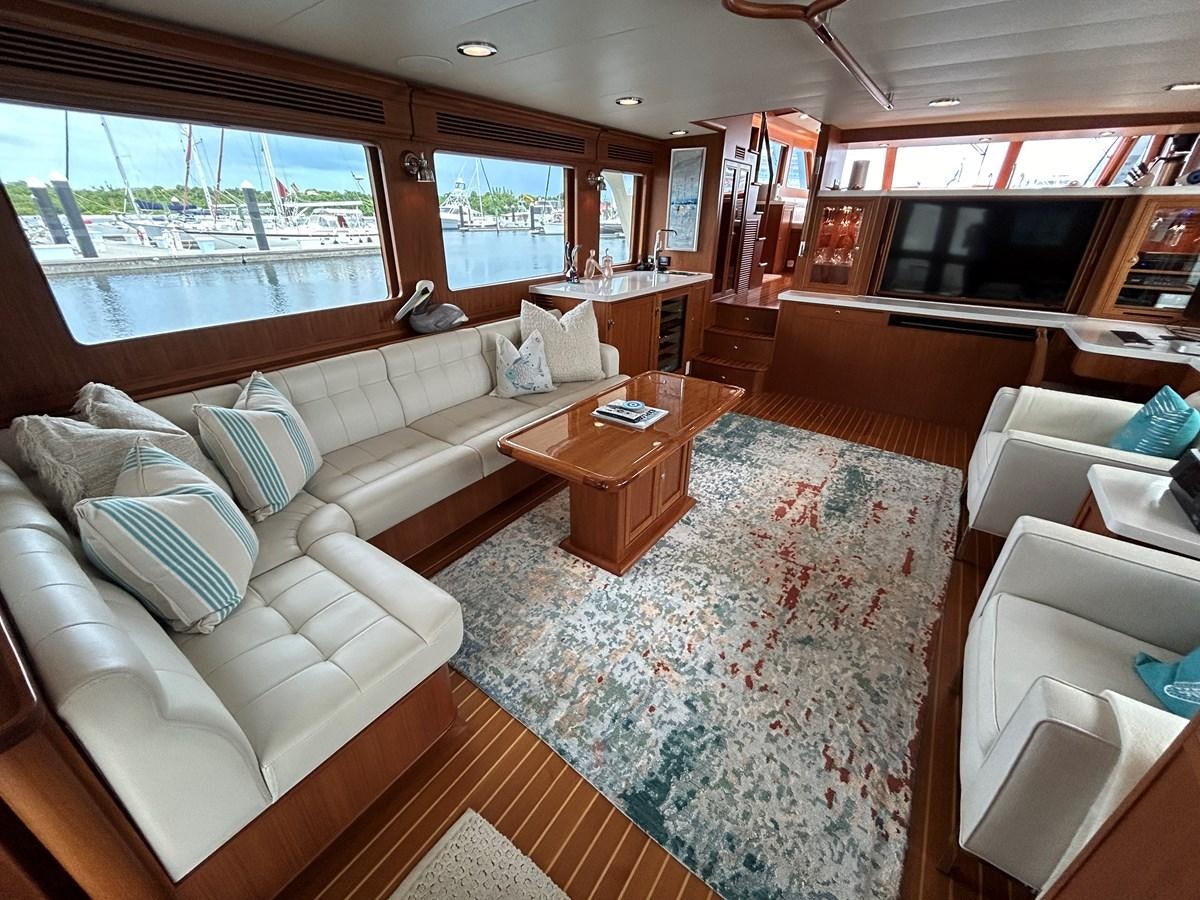 a living room with a couch and a coffee table aboard NOVIA II Yacht for Sale