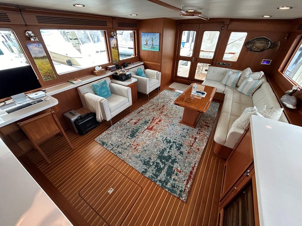 a living room with a large window aboard NOVIA II Yacht for Sale