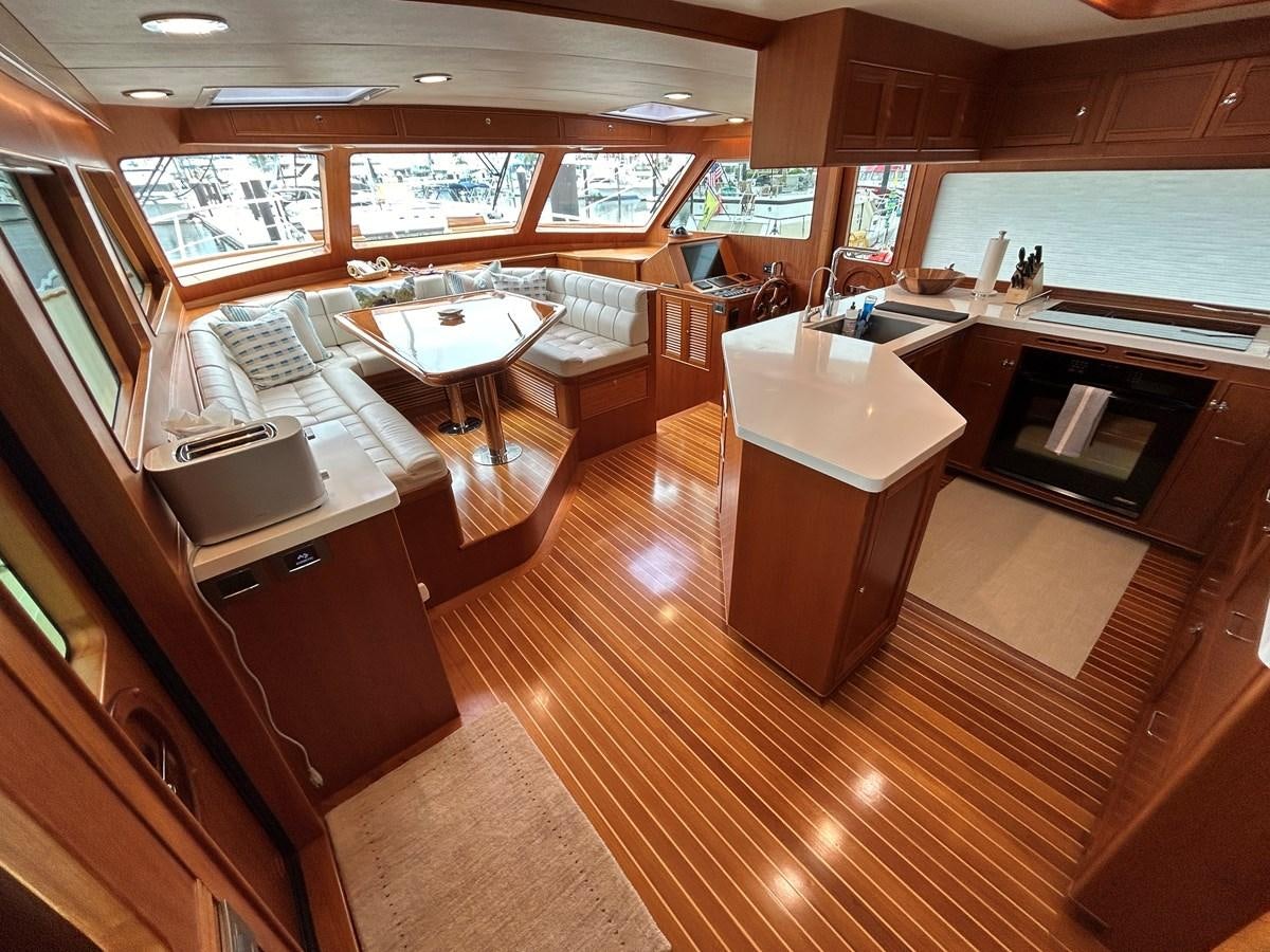 a large kitchen with a dining area aboard NOVIA II Yacht for Sale