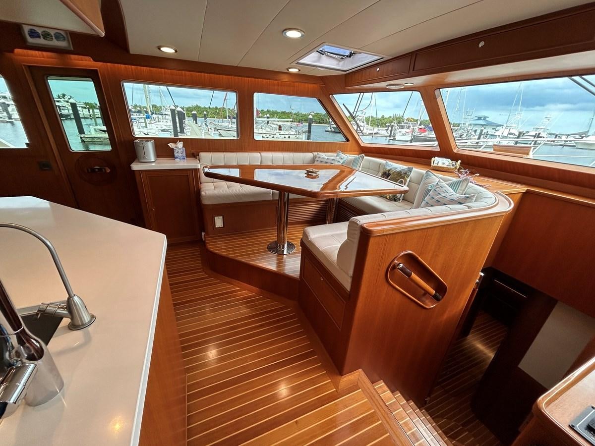 a room with a table and chairs aboard NOVIA II Yacht for Sale
