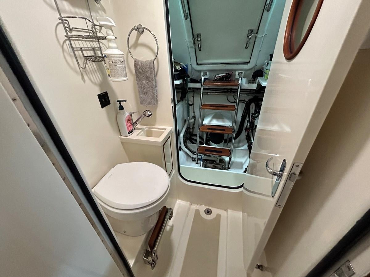 a toilet and sink in a bathroom aboard NOVIA II Yacht for Sale