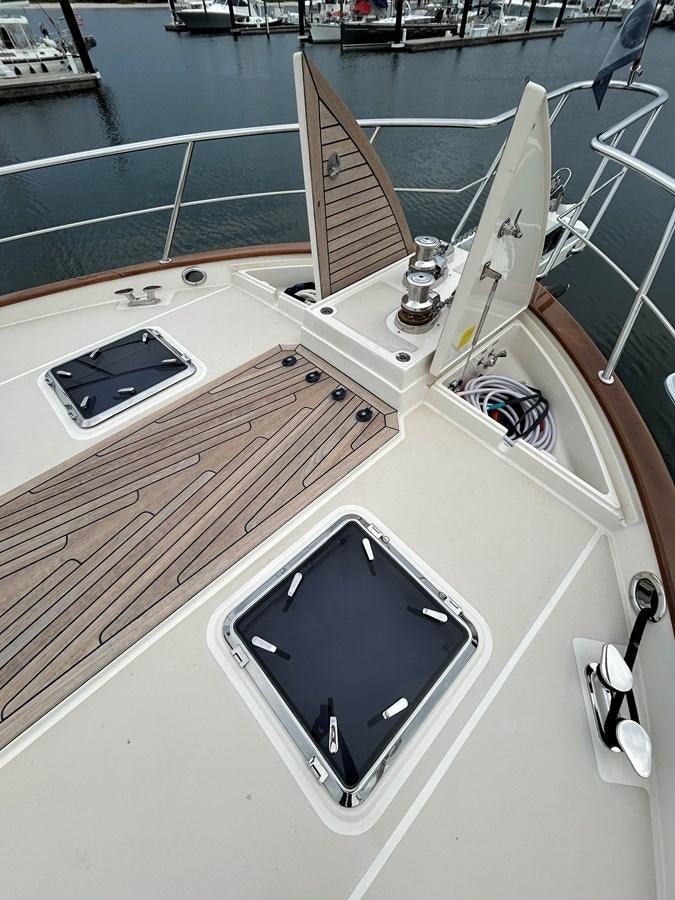 a white boat with a black screen aboard NOVIA II Yacht for Sale
