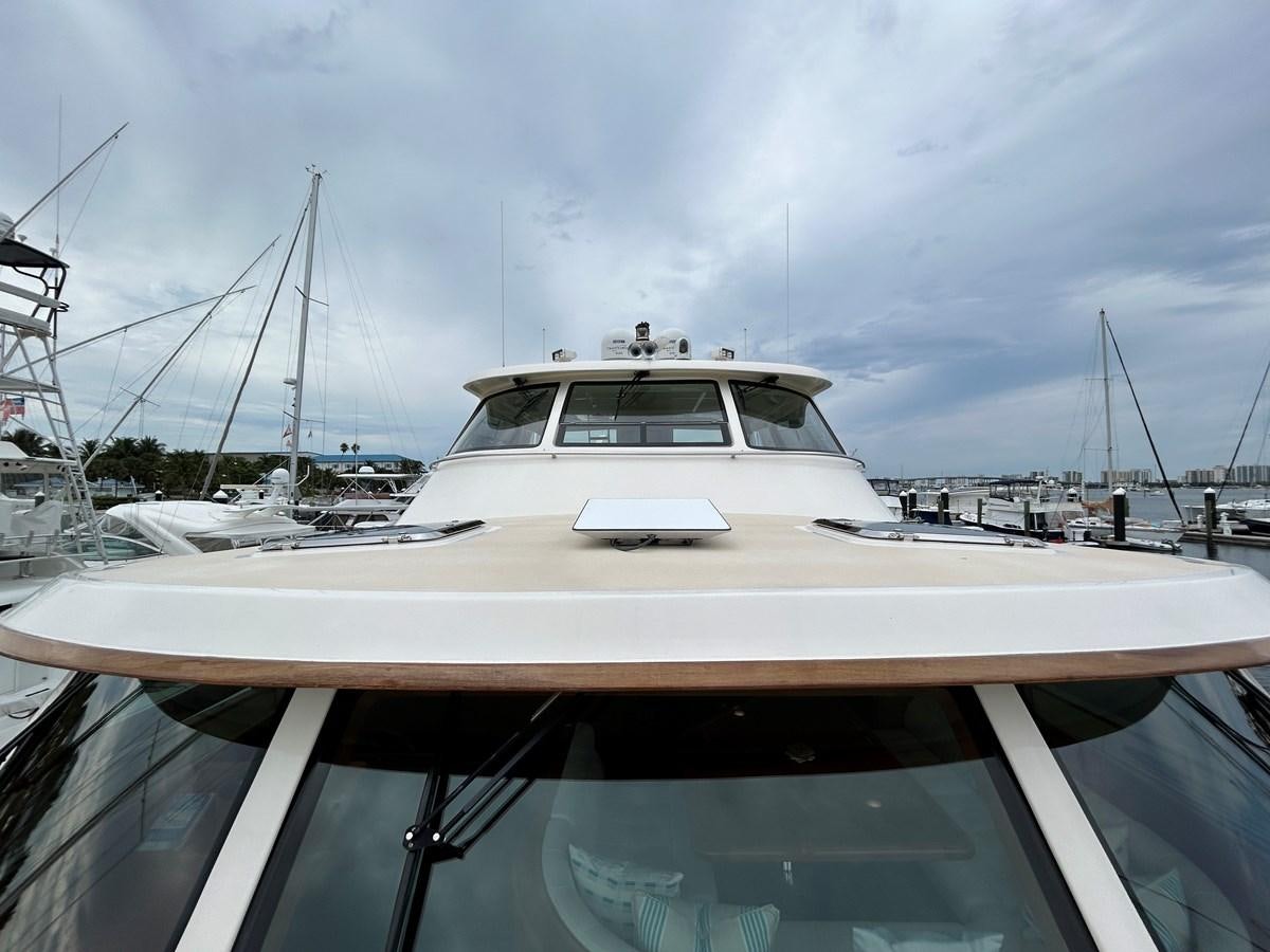 a white yacht in a harbor aboard NOVIA II Yacht for Sale