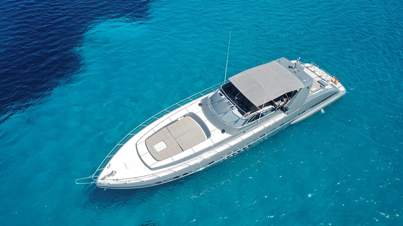 a white boat in the water aboard INFINITY Yacht for Sale