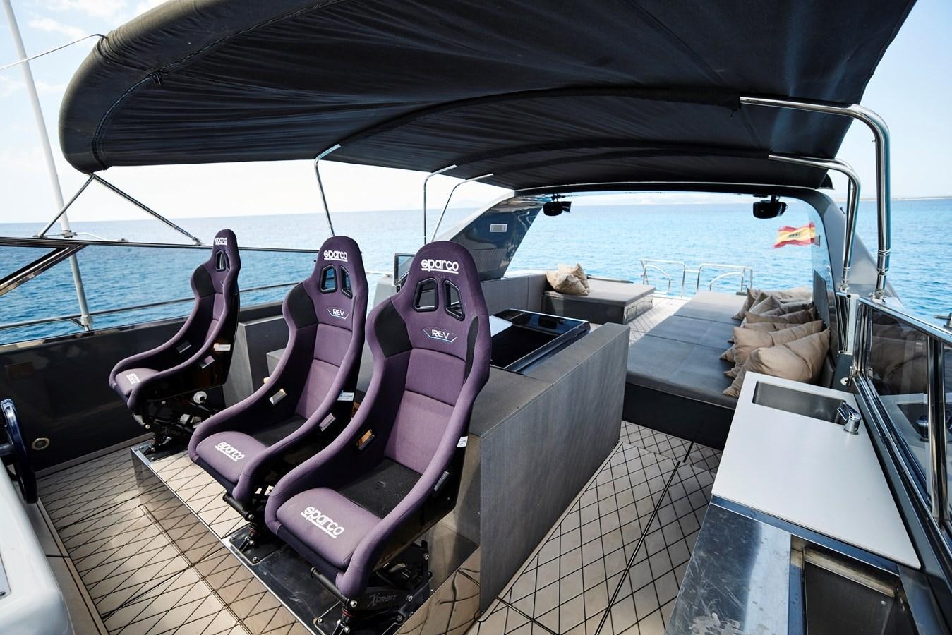 a purple and purple boat on a deck aboard INFINITY Yacht for Sale