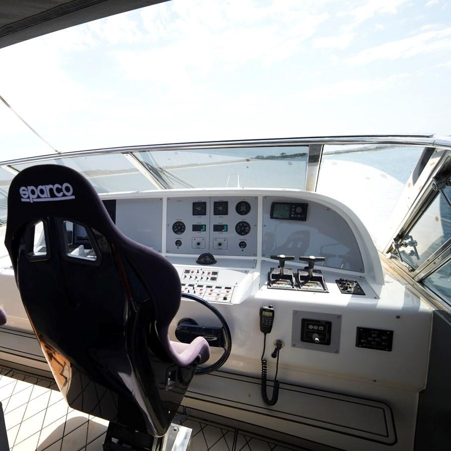 a person driving a car aboard INFINITY Yacht for Sale
