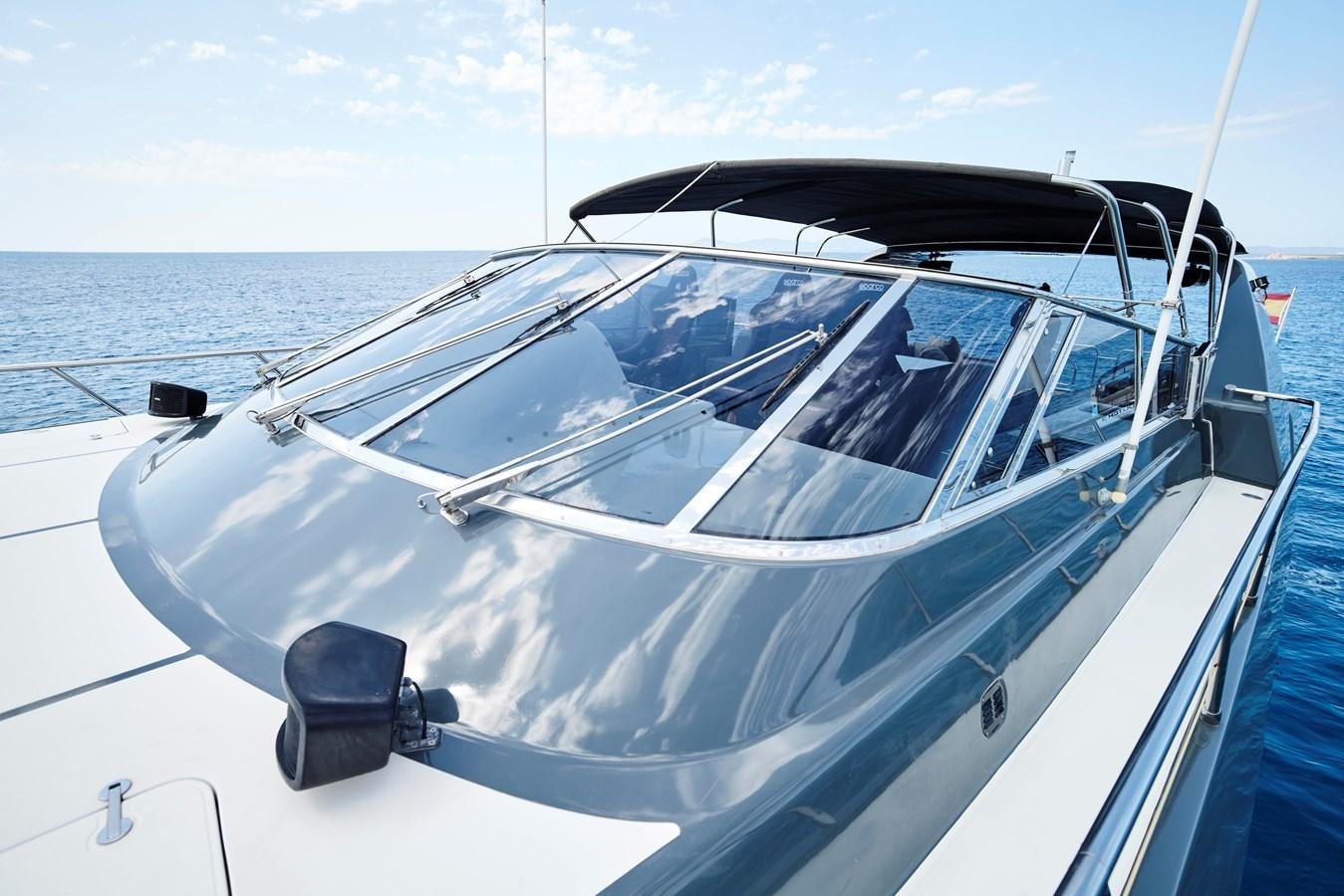 a white boat on the water aboard INFINITY Yacht for Sale