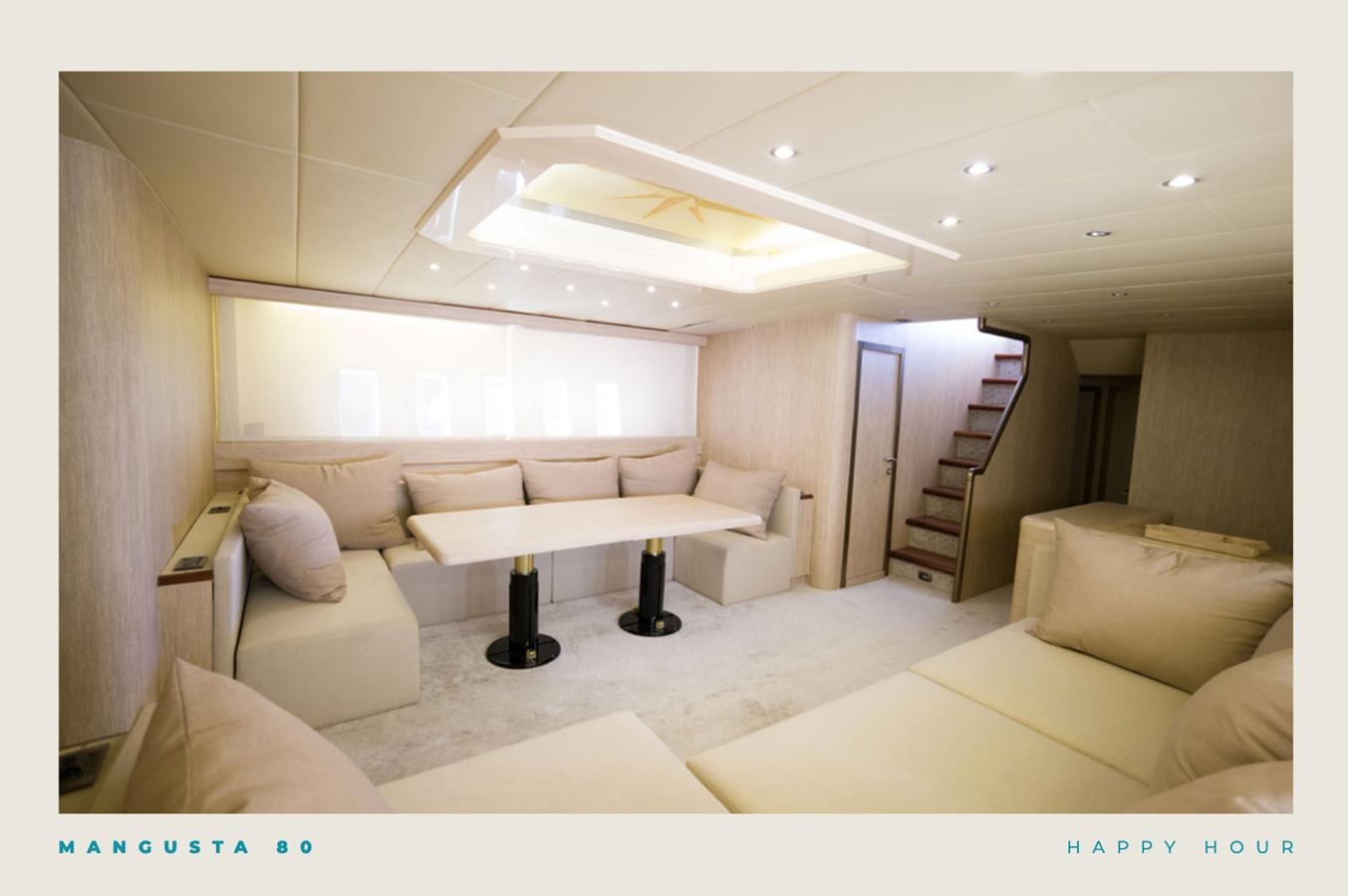 a living room with a staircase aboard INFINITY Yacht for Sale
