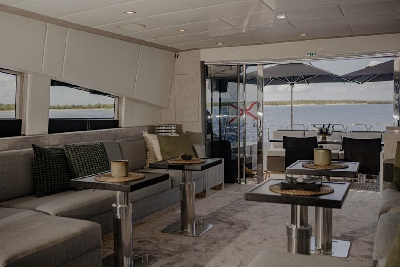 a living room with a table and chairs aboard LEOPARD 31 OPEN Yacht for Sale