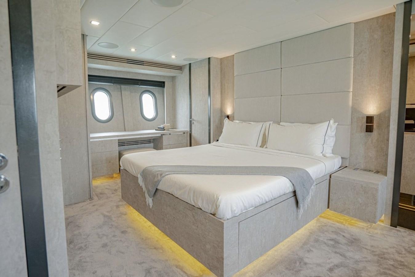 a room with a bed and a mirror aboard LEOPARD 31 OPEN Yacht for Sale