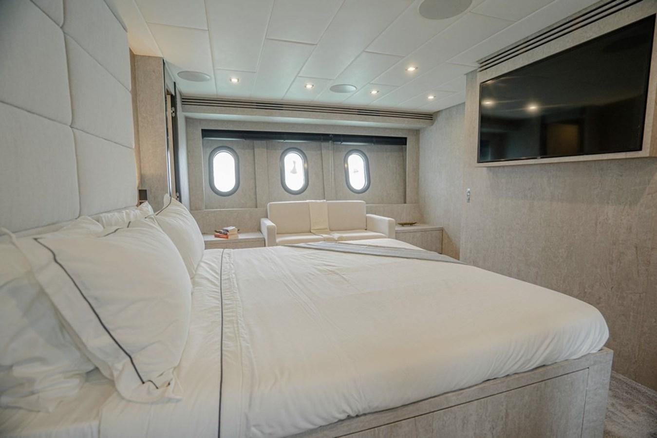 a room with a bed and a mirror aboard LEOPARD 31 OPEN Yacht for Sale