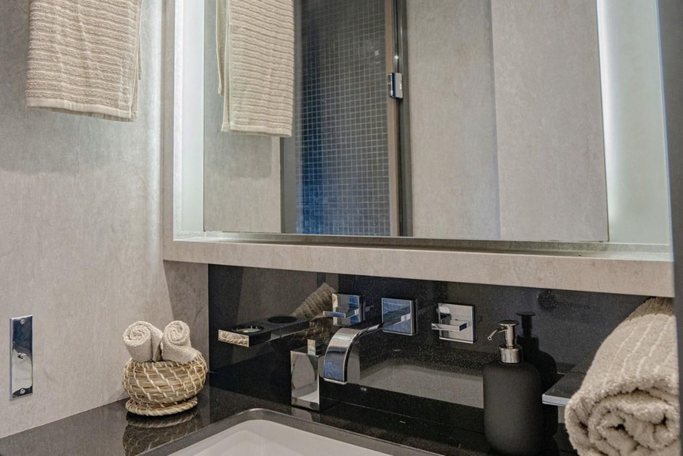 a bathroom with a mirror aboard LEOPARD 31 OPEN Yacht for Sale