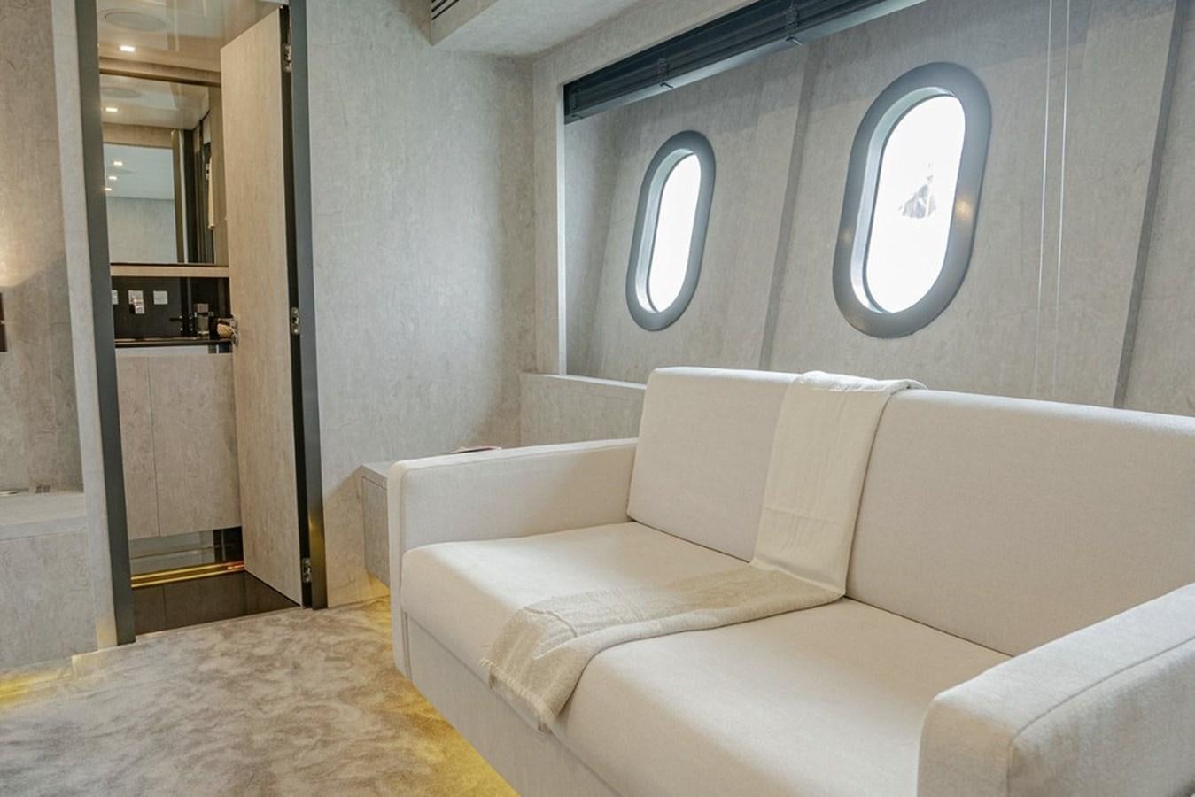 a room with a bed and a mirror aboard LEOPARD 31 OPEN Yacht for Sale