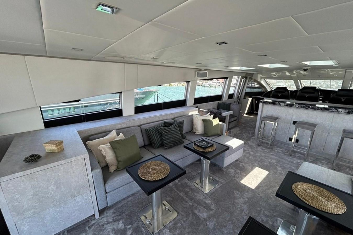 a large living room with a large screen aboard LEOPARD 31 OPEN Yacht for Sale