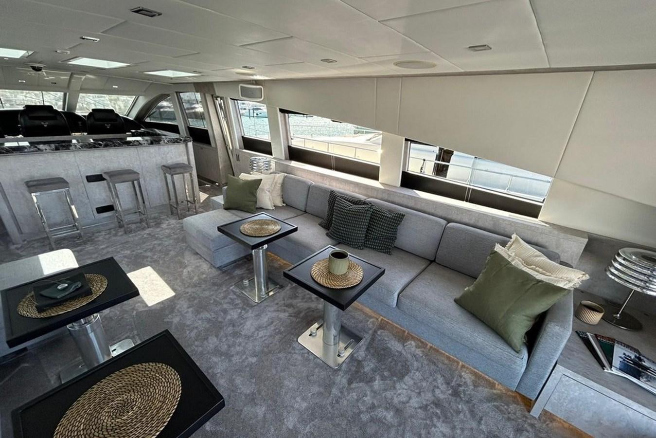 a large living room with a large glass coffee table aboard LEOPARD 31 OPEN Yacht for Sale