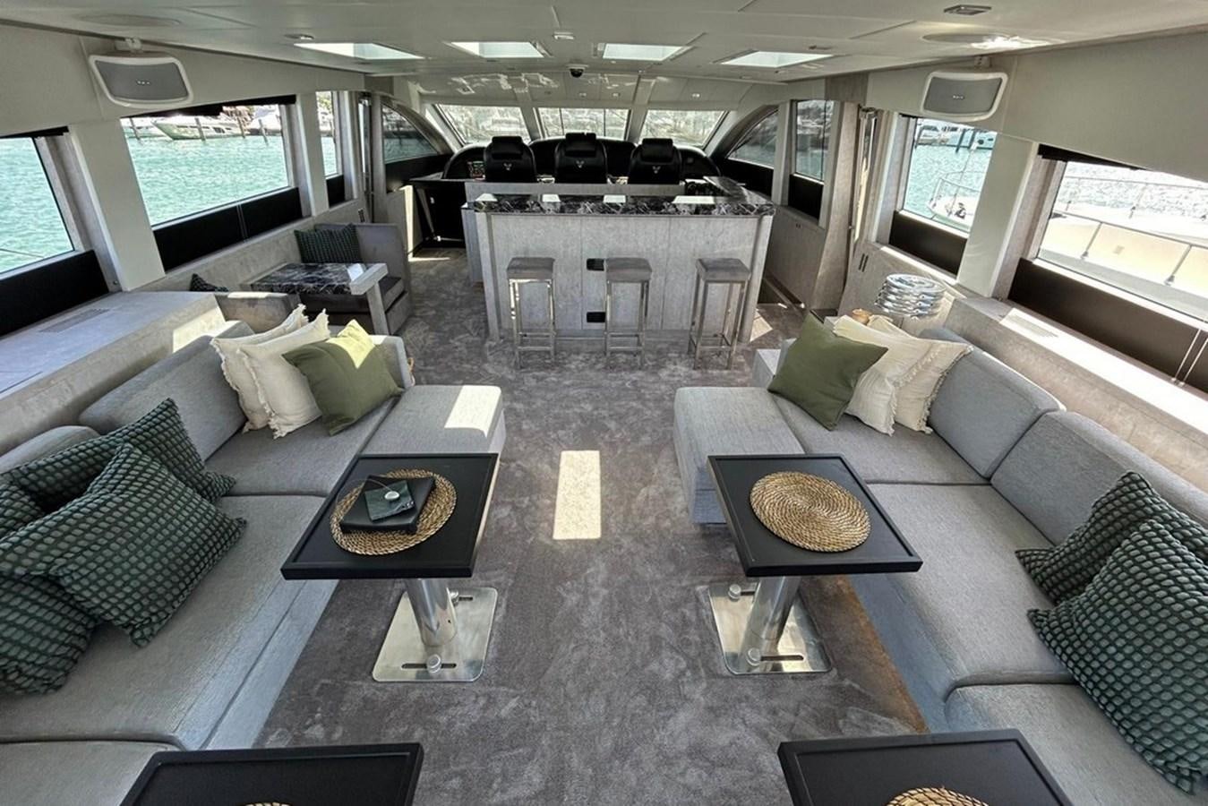 a living room with a couch and a coffee table aboard LEOPARD 31 OPEN Yacht for Sale