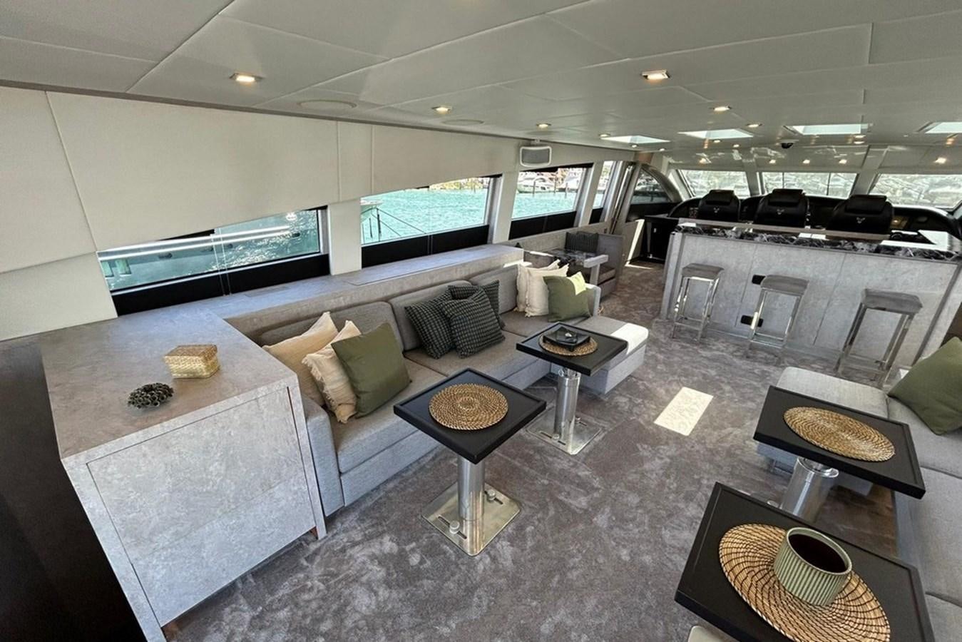a large room with a couch and a table aboard LEOPARD 31 OPEN Yacht for Sale