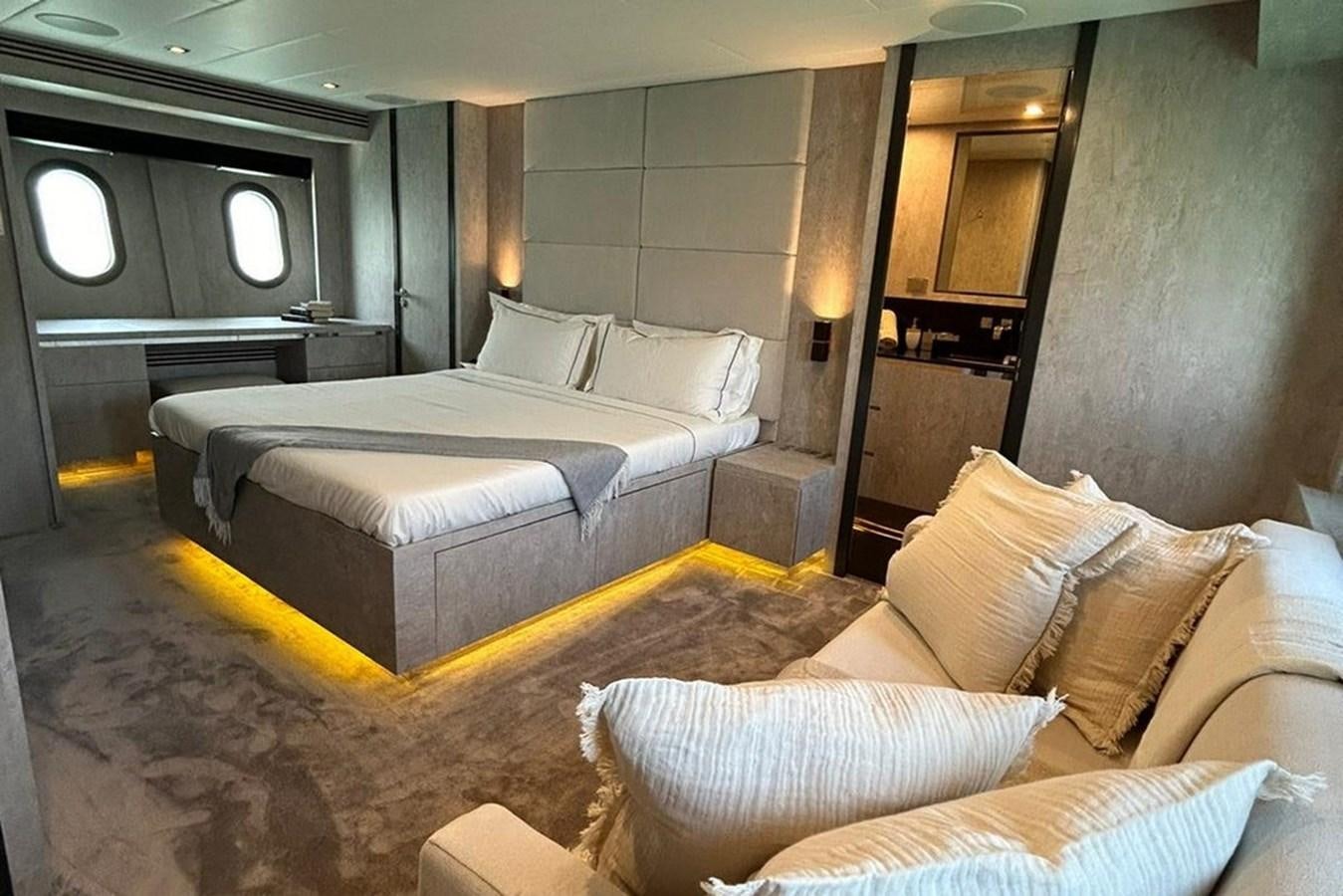 a room with a bed and a couch aboard LEOPARD 31 OPEN Yacht for Sale