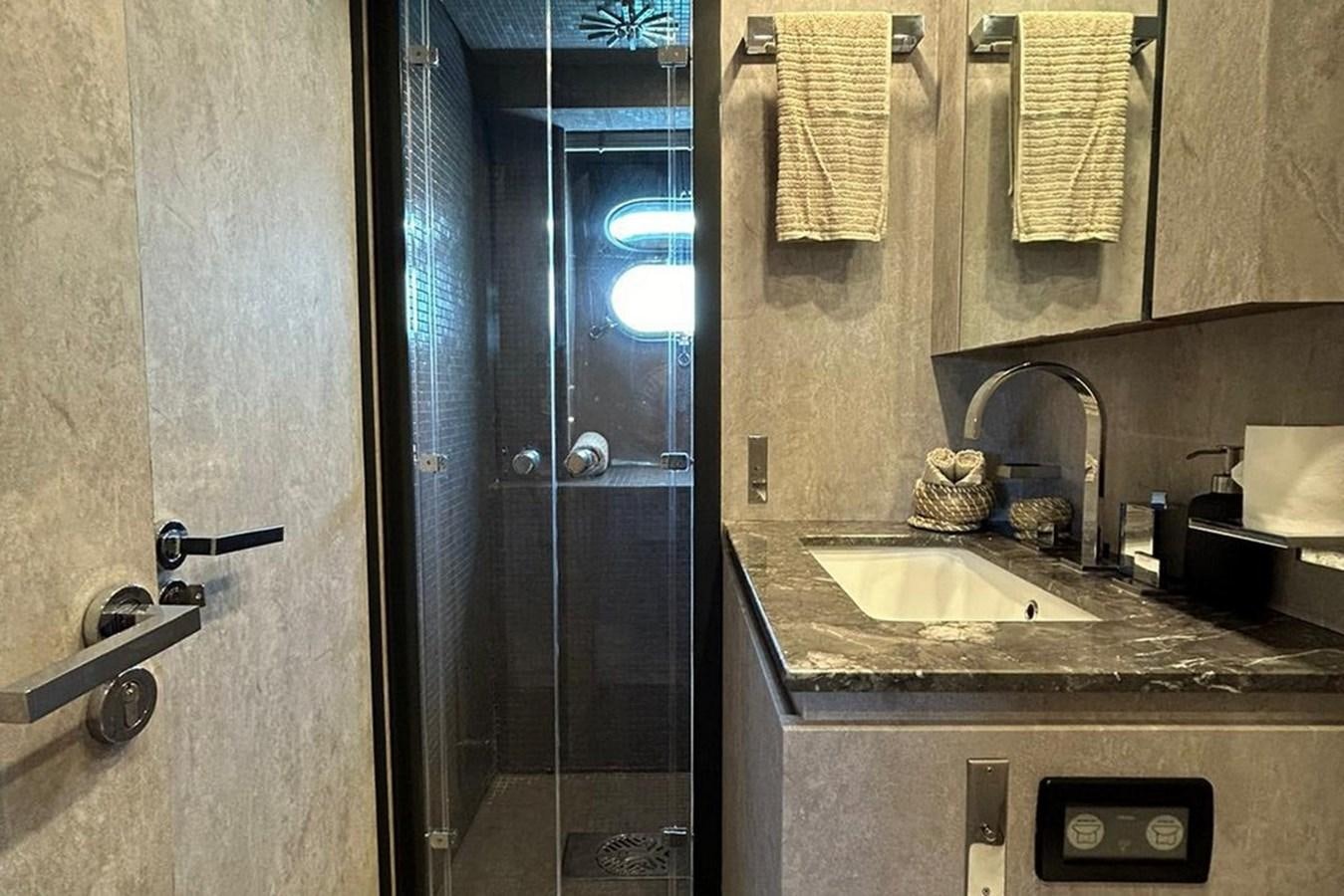 a bathroom with a sink and a shower aboard LEOPARD 31 OPEN Yacht for Sale