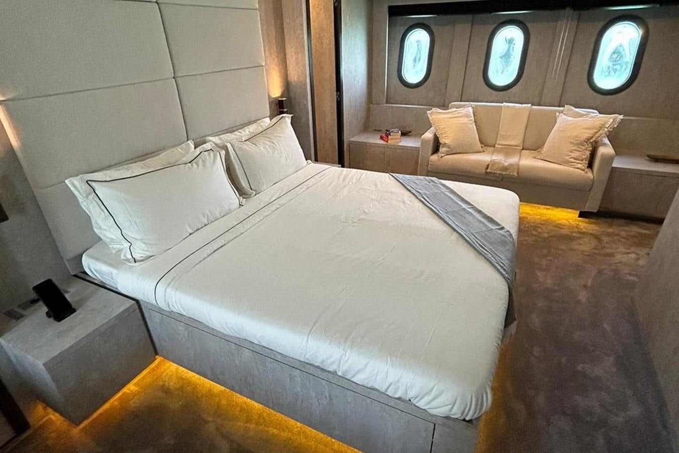 a bed with white sheets aboard LEOPARD 31 OPEN Yacht for Sale