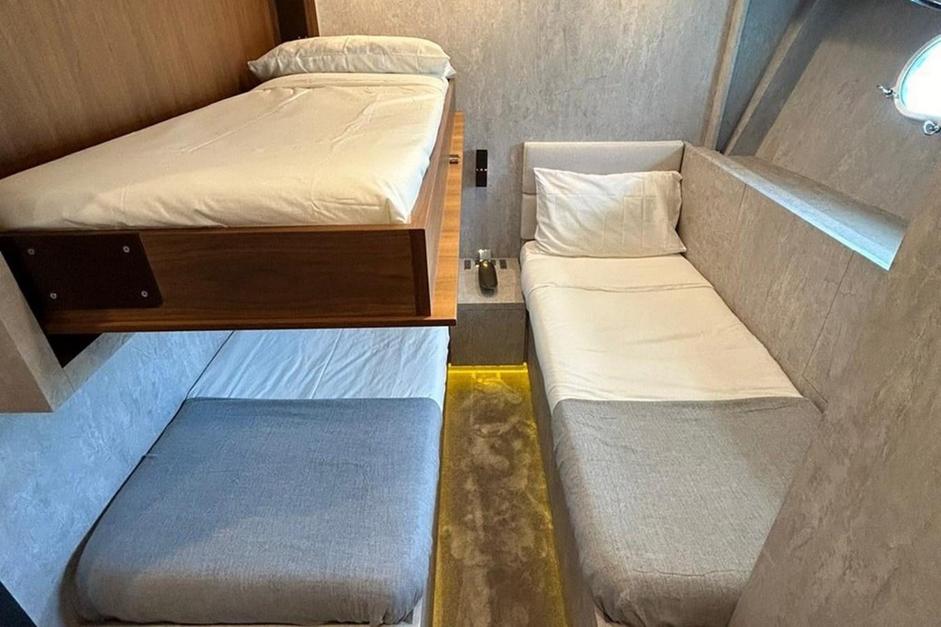 a couple of beds in a room aboard LEOPARD 31 OPEN Yacht for Sale