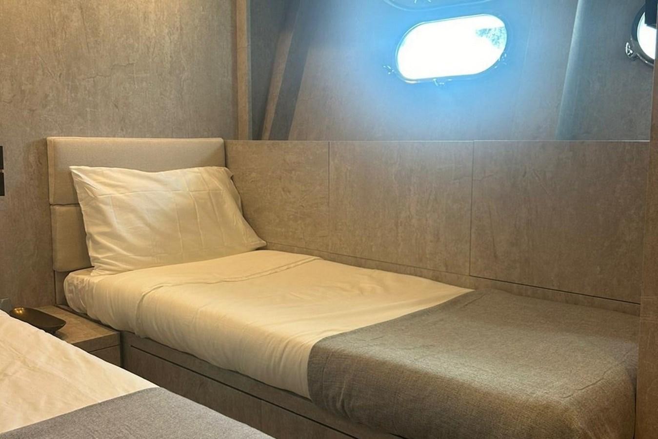 a bed in a room aboard LEOPARD 31 OPEN Yacht for Sale