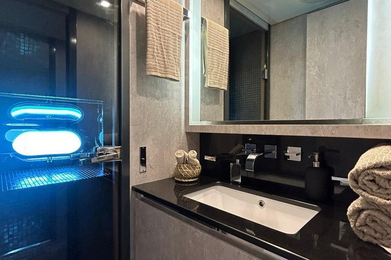 a bathroom with a blue light aboard LEOPARD 31 OPEN Yacht for Sale