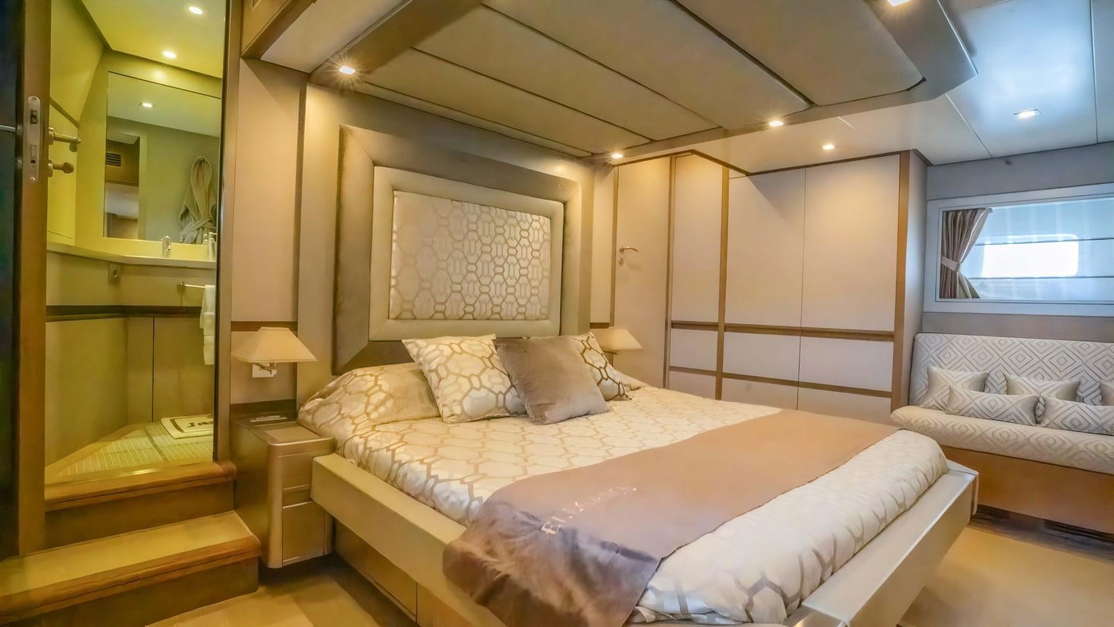 a room with a bed and a mirror aboard ELEGANCE OF CANNES Yacht for Sale