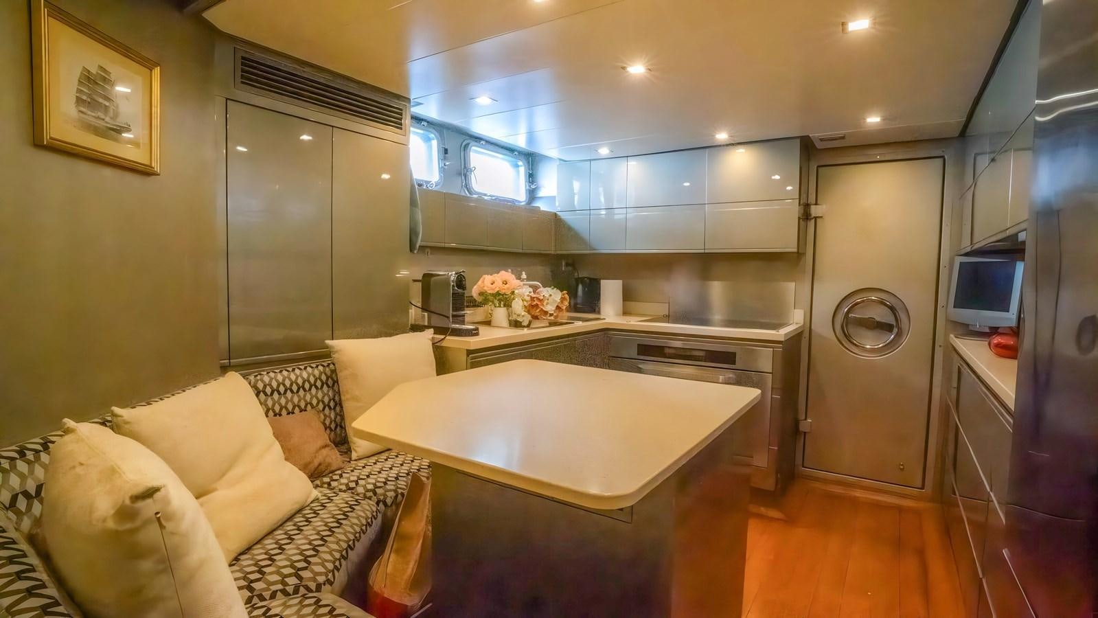 a kitchen with a large island aboard ELEGANCE OF CANNES Yacht for Sale