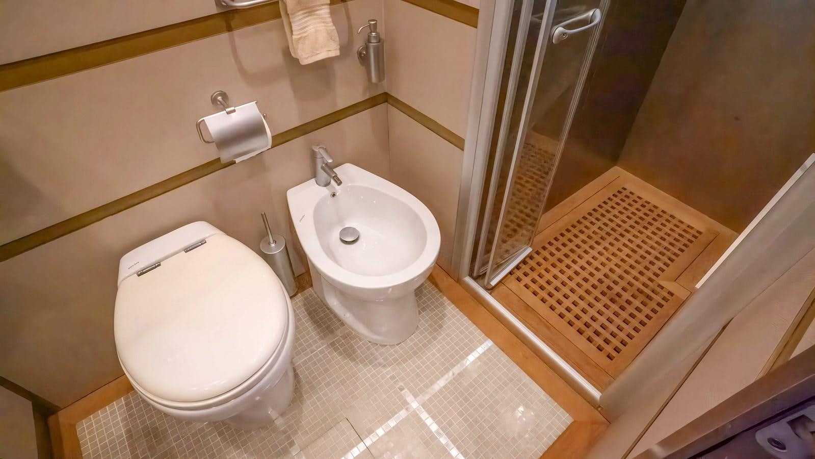a bathroom with a toilet and sink aboard ELEGANCE OF CANNES Yacht for Sale