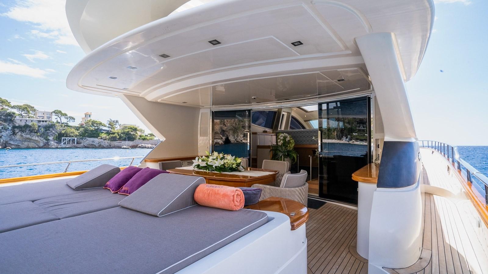 a room with a bed and a view of the water aboard ELEGANCE OF CANNES Yacht for Sale