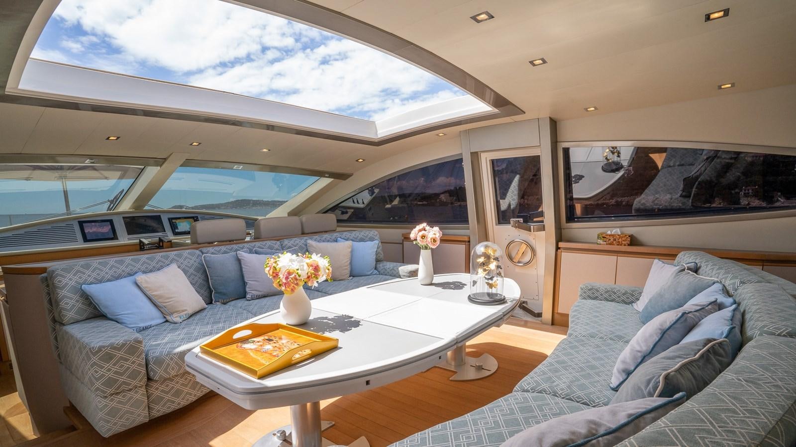 a living room with a couch and a table aboard ELEGANCE OF CANNES Yacht for Sale