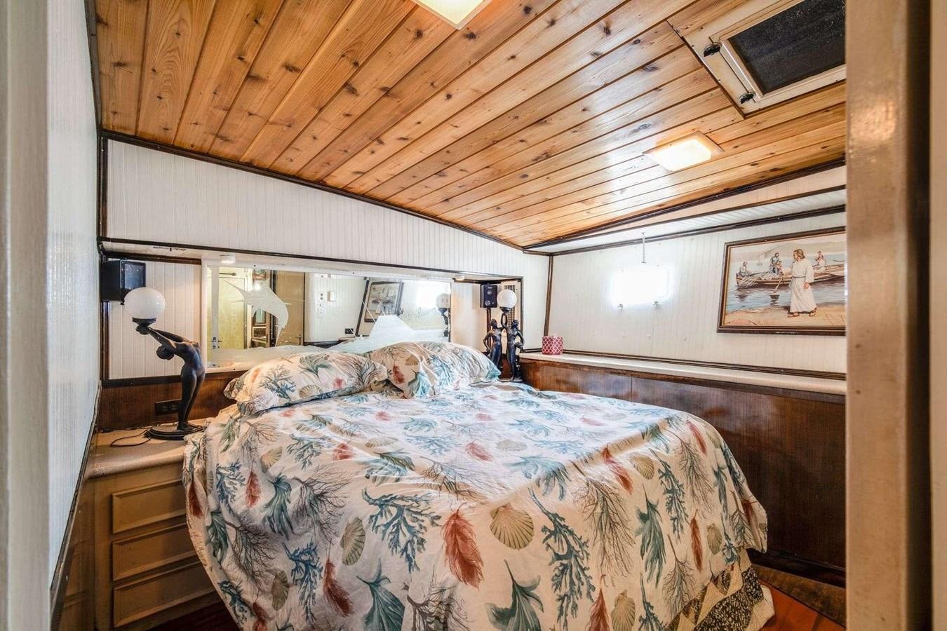 a bed with a wooden canopy aboard SEA WOLF Yacht for Sale