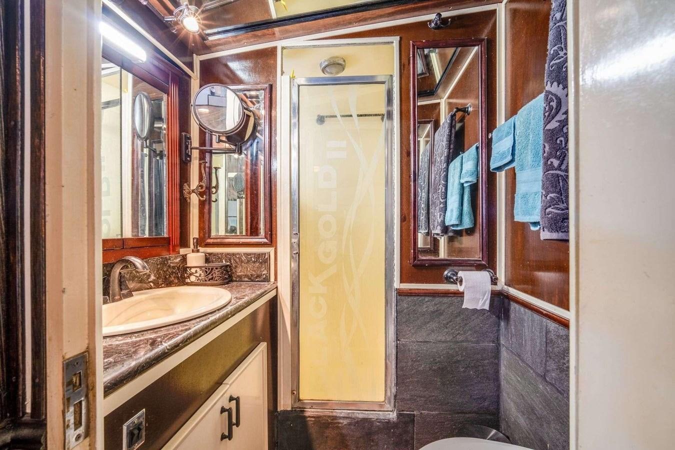 a bathroom with a yellow door aboard SEA WOLF Yacht for Sale