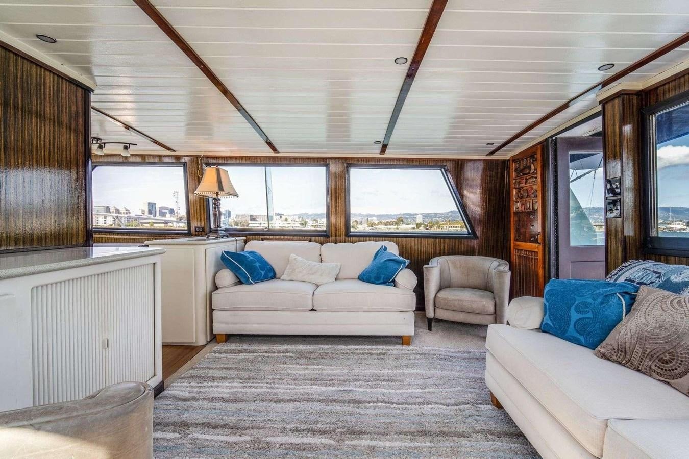 a living room with a couch and a television aboard SEA WOLF Yacht for Sale