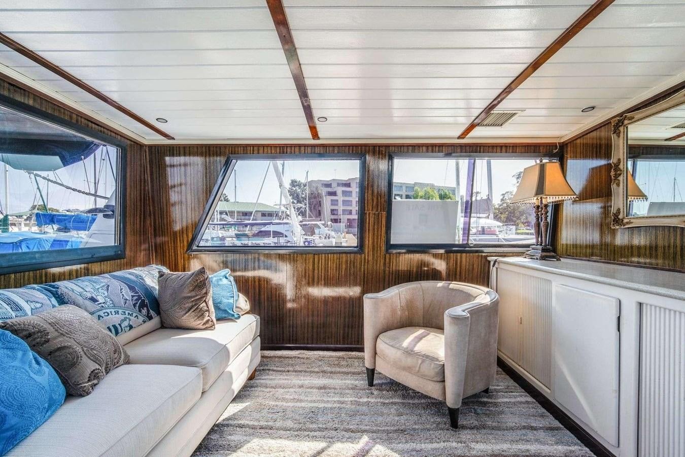 a living room with a couch and a television aboard SEA WOLF Yacht for Sale